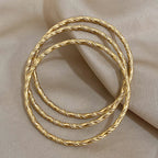 Safiya – Lot 3 Bracelets Dorés Torsadés Acier Inoxydable Waterproof | FancyFez