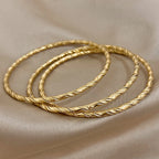 Safiya – Lot 3 Bracelets Dorés Torsadés Acier Inoxydable Waterproof | FancyFez